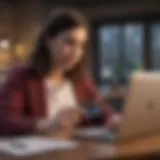 A young graduate analyzing credit card options on a laptop