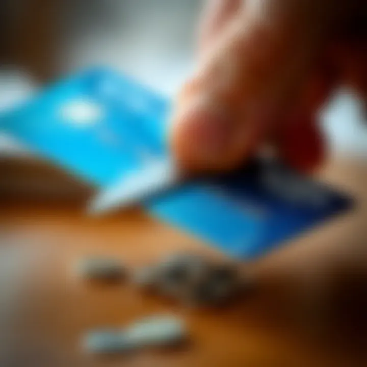 A close-up of a credit card being cut in half