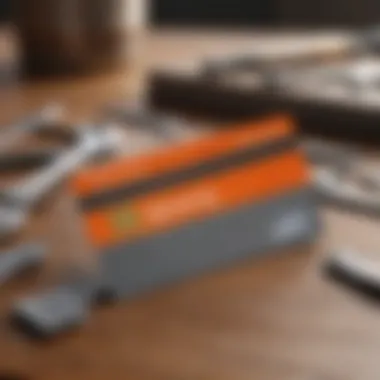 A close-up of a Home Depot credit card on a wooden table surrounded by tools